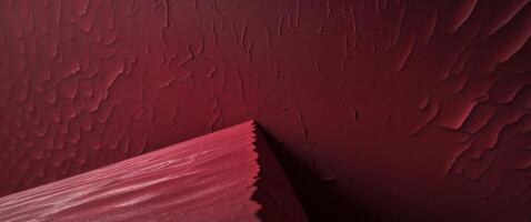 A red wall with paint on it photo