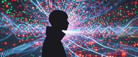 A man standing in front of a colorful light display photo