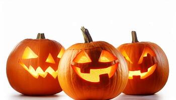 Three Jack o' lanterns with lit faces Halloween pumpkins isolated on white background photo