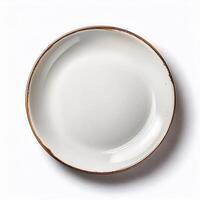 Empty ceramic plate with brown rim perfect for food or restaurant menus Top view isolated on white background photo