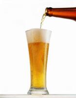Pouring Refreshing Golden Beer into a Glass on White Background Perfect for Brewery Advertisements photo