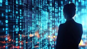 A woman in a suit standing in front of a digital screen displaying binary code. photo