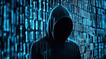 A hooded figure in front of a binary code wall photo