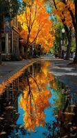 Autumn reflection in a quiet street with vibrant trees and a puddle capturing colorful leaves photo