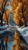 Vibrant autumn scene with golden trees and reflective water along a snow-covered road photo
