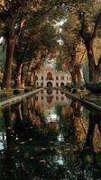 Beautiful garden reflections at a historic palace under trees in autumn photo
