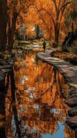Beautiful autumn walk along a peaceful stream with vibrant orange trees reflecting on the water photo