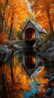 Colorful autumn landscape with rustic house by a tranquil stream surrounded by vibrant foliage photo