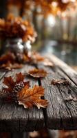 Autumn leaves and pine cones on weathered wooden table by a serene riverbank in a tranquil forest setting photo