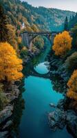 Stunning autumn landscape showcasing a bridge and river surrounded by vibrant foliage in a serene setting photo