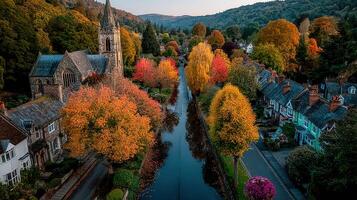 Charming autumn view over a canal in a picturesque village surrounded by trees and a historic church photo