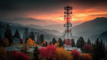 Sunset over a telecommunications tower in the mountains with autumn foliage and scenic valley view photo