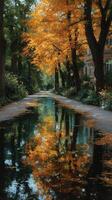 Golden autumn leaves reflect in a serene pond along a tree-lined path in the heart of the city during a quiet afternoon photo