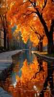 Autumn trees reflect in tranquil water along a peaceful pathway in a vibrant park at sunset photo