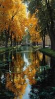 Autumn leaves reflect in calm waters of a scenic canal surrounded by trees in a peaceful park setting photo