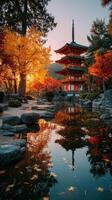Autumn colors surround a traditional pagoda by a tranquil pond in a serene garden photo