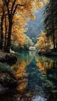 Serene autumn landscape with golden leaves reflecting in tranquil waters of a forest lake during daylight photo