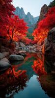 Majestic autumn landscape with vibrant red trees reflecting in serene water near rocky mountains photo