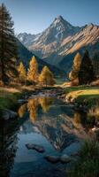 Autumn landscape with mountains and river reflecting trees in a tranquil setting photo