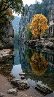 Autumn colors reflect in peaceful riverside landscape with rocky cliffs at dawn photo