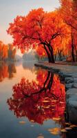 Autumn landscape with vibrant orange trees reflecting in tranquil water during golden hour photo