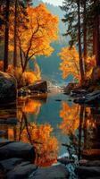 Vibrant autumn foliage reflects in a serene river surrounded by rocky banks and towering trees during golden hour photo