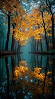 Vibrant autumn leaves reflect beautifully in a tranquil forest lake at dawn photo