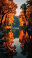 Colorful autumn landscape with vibrant trees reflecting in calm water during sunset photo