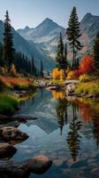 Vibrant autumn landscape with a tranquil stream reflecting mountains in a serene setting photo