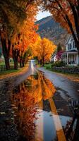 Vibrant autumn colors reflect on a tranquil country road after rain in a picturesque rural setting photo