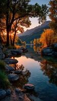 Sunset casting warm hues over serene river framed by vibrant trees and rocky shoreline photo
