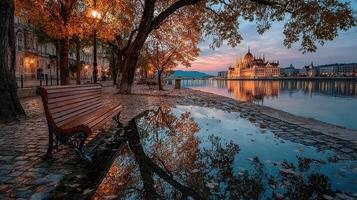 Autumn evening view of the Danube River with reflections and historic architecture in Budapest's skyline photo