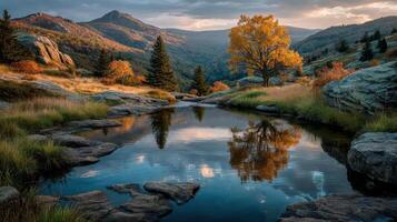 Stunning autumn landscape with reflective water at sunset in the mountains photo