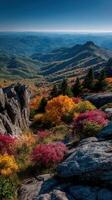 Vibrant autumn foliage blankets the mountains in a colorful landscape during a clear day in the Blue Ridge region photo