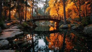 Beautiful autumn evening with a wooden bridge over calm waters in a wooded area photo