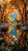 Vivid autumn foliage cast reflections on a tranquil river in a picturesque valley setting photo
