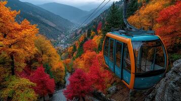 Cable car gliding through vibrant autumn foliage in mountainous scenery photo