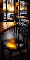 Cozy evening at a cafe with warm light reflecting on furniture photo