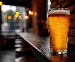 Refreshing beer served in a cozy bar setting during evening photo