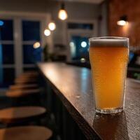 Refreshing craft beer served at a cozy bar in the evening photo