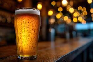 Refreshing golden beer served in a cozy bar during evening photo