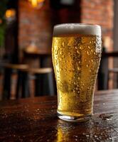 Refreshing beer glass on a wooden table in a pub setting photo