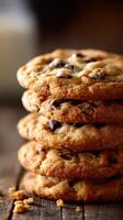 Freshly baked cookies stacked on a wooden table photo