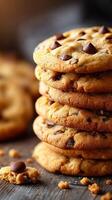 Delicious stack of chocolate chip cookies on wooden table photo