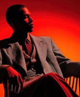 Stylish man posing in dramatic lighting with a modern flair photo