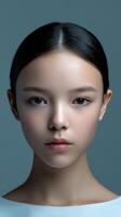 Young woman with a calm expression and smooth skin photo