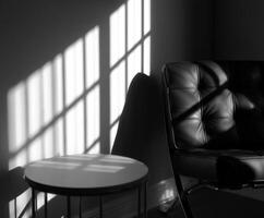 Black and white photo of a chair and table