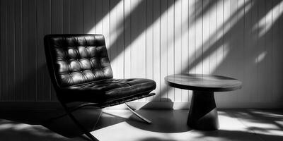 A black and white photo of a chair and table