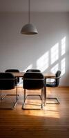 Modern Bauhaus dining space with natural light enhancing wooden floors photo