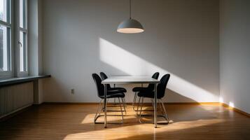 Bauhaus design influences in a minimalist dining area with natural light photo